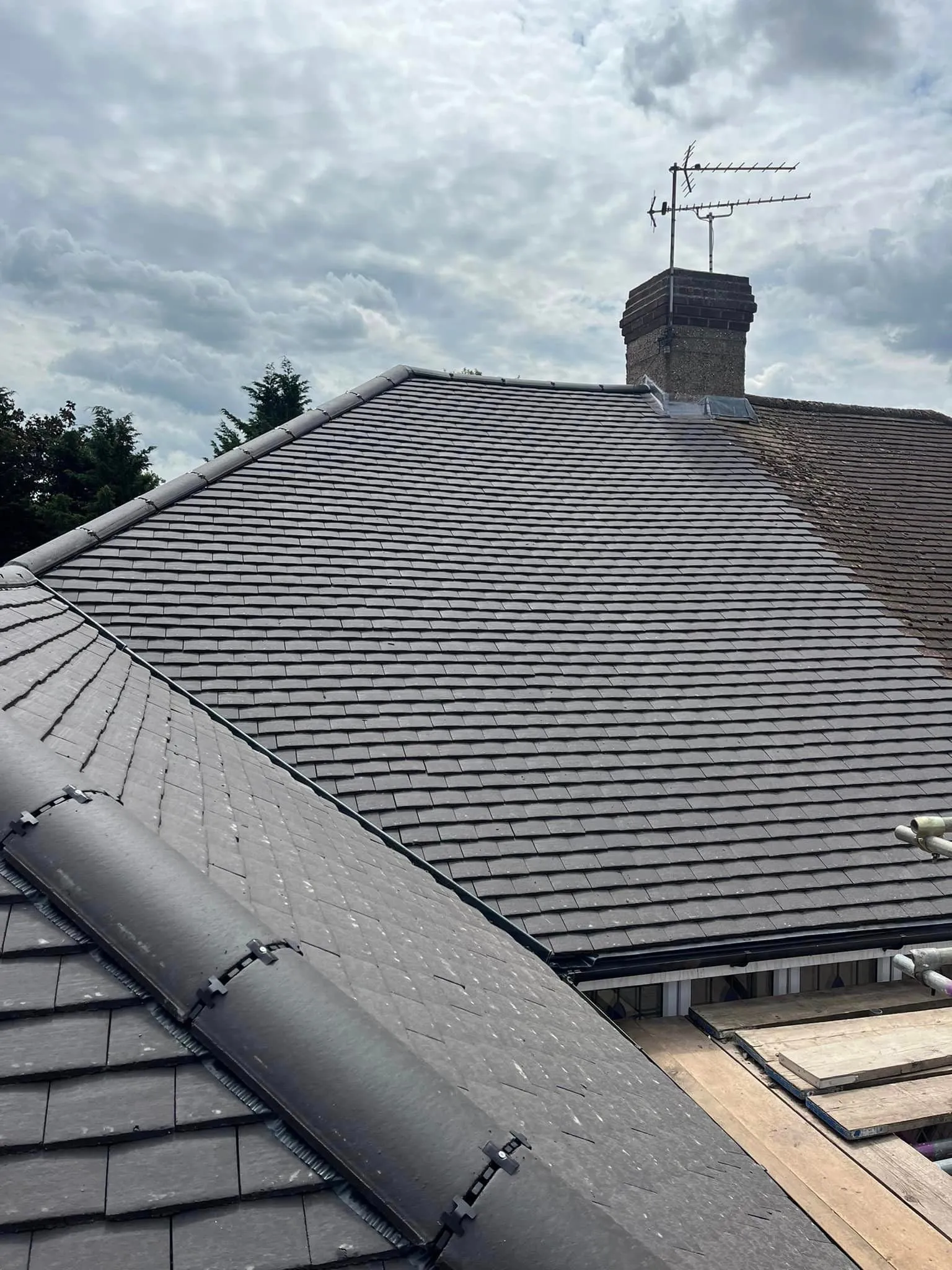 Slate roof installation with chimney work